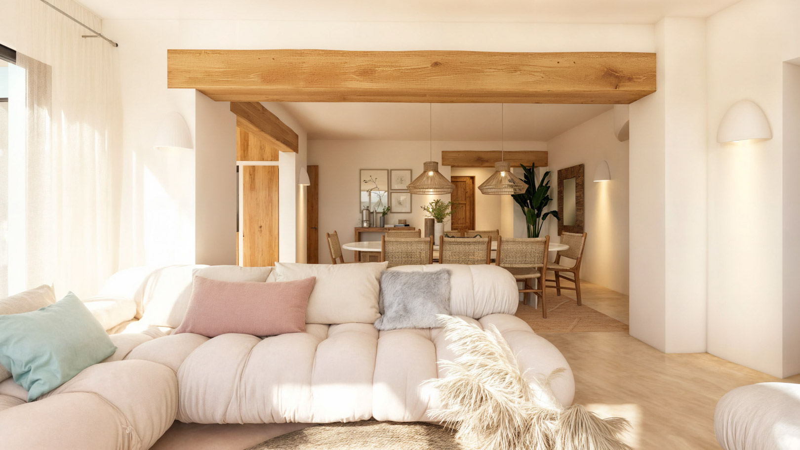 Salón comedor de concepto abierto con vigas de madera natural, sofá modular en tonos neutros y zona de comedor con lámparas de fibras naturales.