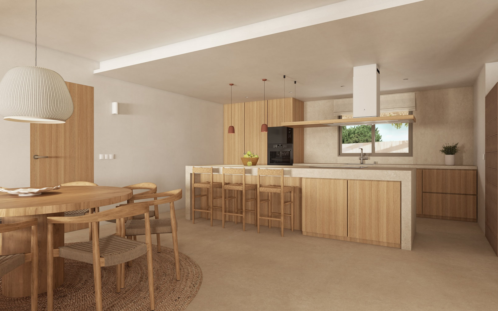 Cocina de concepto abierto con isla de piedra, mobiliario de madera clara y comedor integrado con mesa redonda y sillas de fibras naturales bajo luz cálida.