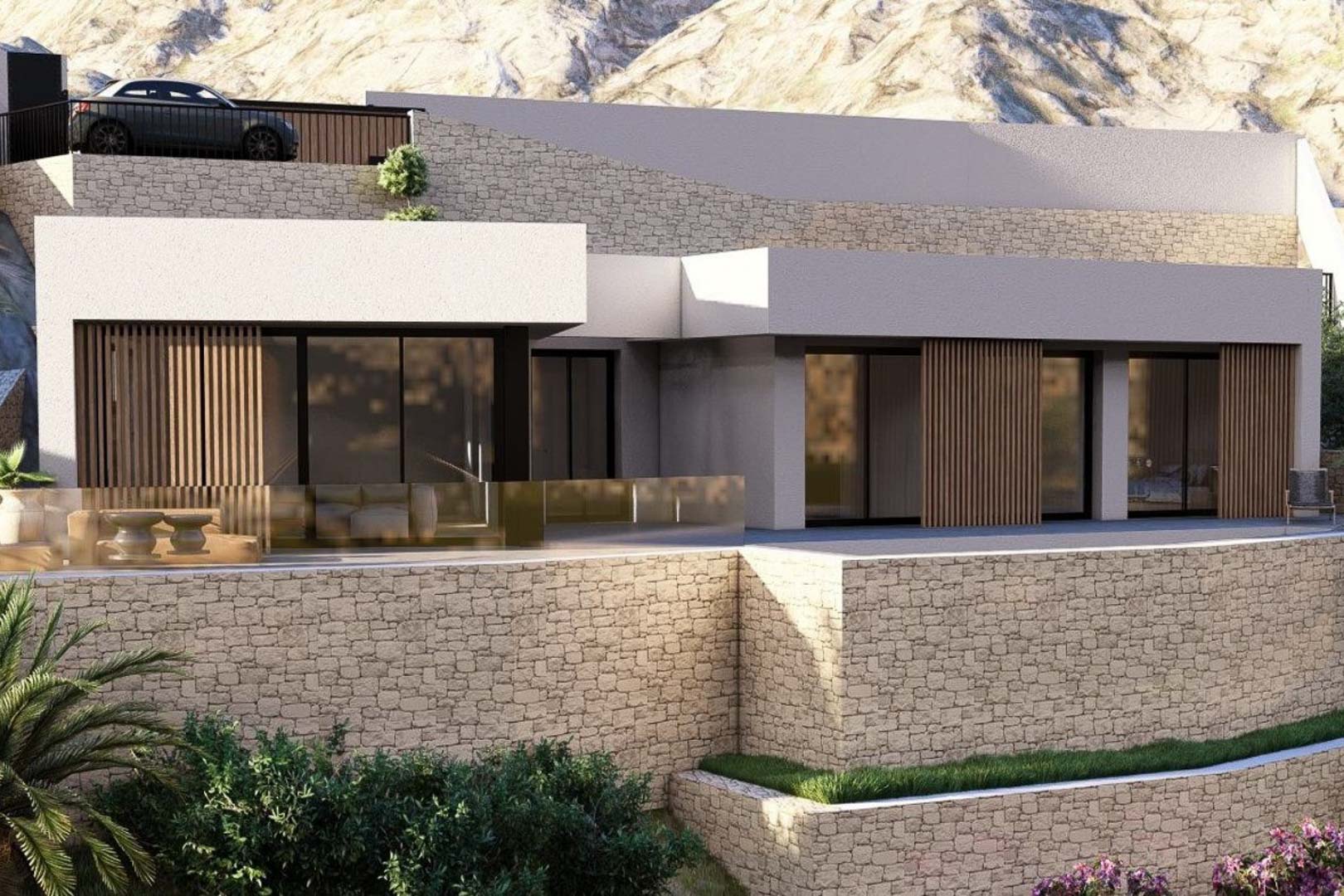Fachada exterior de la villa moderna con muros de piedra natural, ventanales de suelo a techo con lamas de madera y una terraza con barandilla de cristal frente a la montaña.