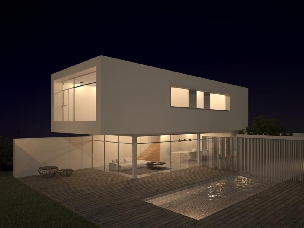 Vista nocturna de la villa con planta superior volada, piscina iluminada y amplios ventanales que integran el salón de planta abierta con la terraza de madera.