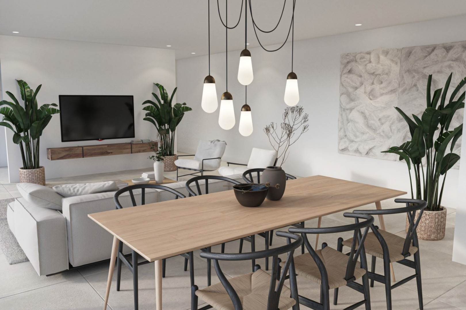 Salón-comedor de concepto abierto con mesa de madera clara, sillas negras de diseño y lámpara colgante múltiple. Incluye zona de TV con mueble flotante y plantas naturales.