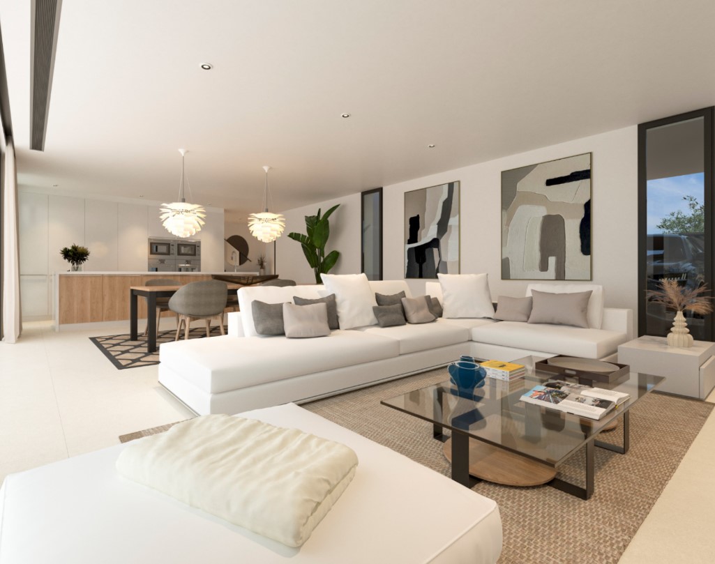 Salón de concepto abierto con un amplio sofá blanco, mesa de centro de cristal y zona de comedor integrada que conecta con la cocina de diseño.