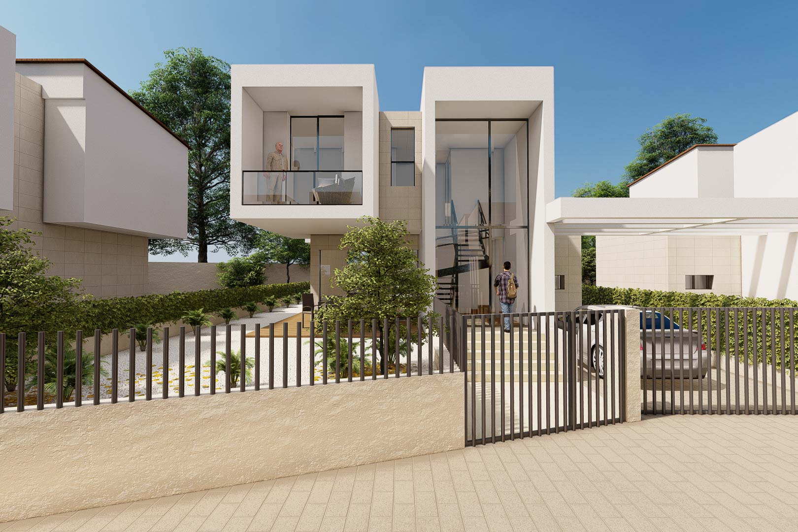 Fachada de diseño cúbico con entrada acristalada de doble altura, balcón voladizo y zona de aparcamiento privada delimitada por vallado metálico.
