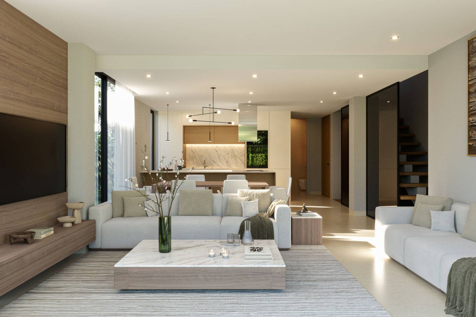 Salón de concepto abierto con panelado de madera, mesa de centro de mármol y cocina integrada con acabados en piedra natural y escalera volada de madera.