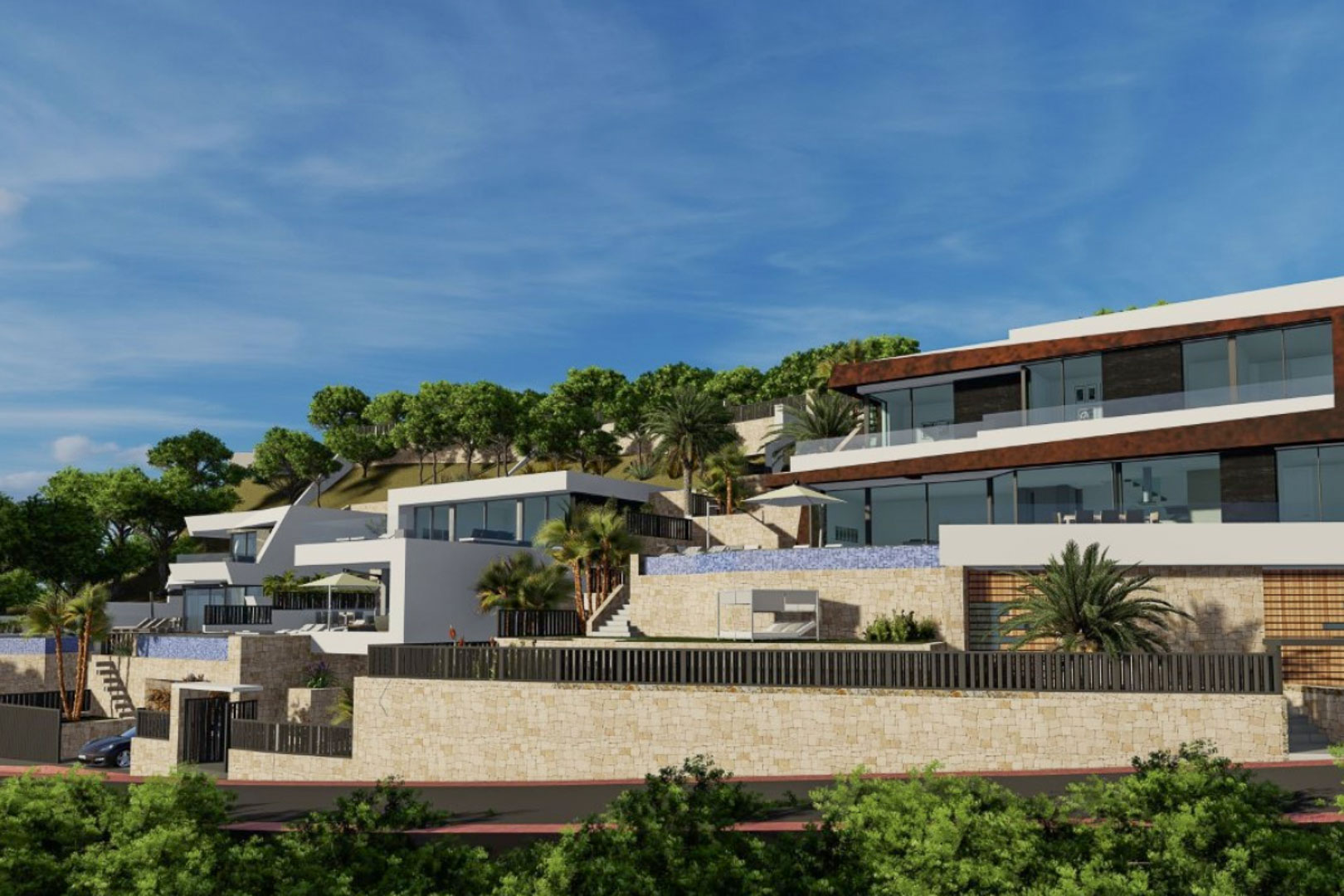 Vista exterior de la villa moderna con arquitectura en niveles, muros de piedra natural, piscina infinity y amplios ventanales que integran el paisaje mediterráneo.