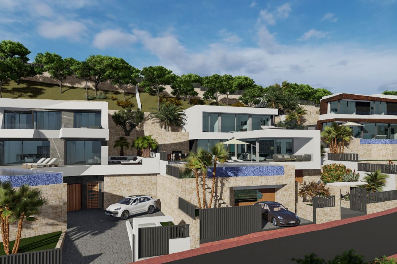 Vista exterior de villas modernas con fachadas blancas y muros de piedra, integradas en la ladera con piscinas infinity y garajes privados a nivel de calle.