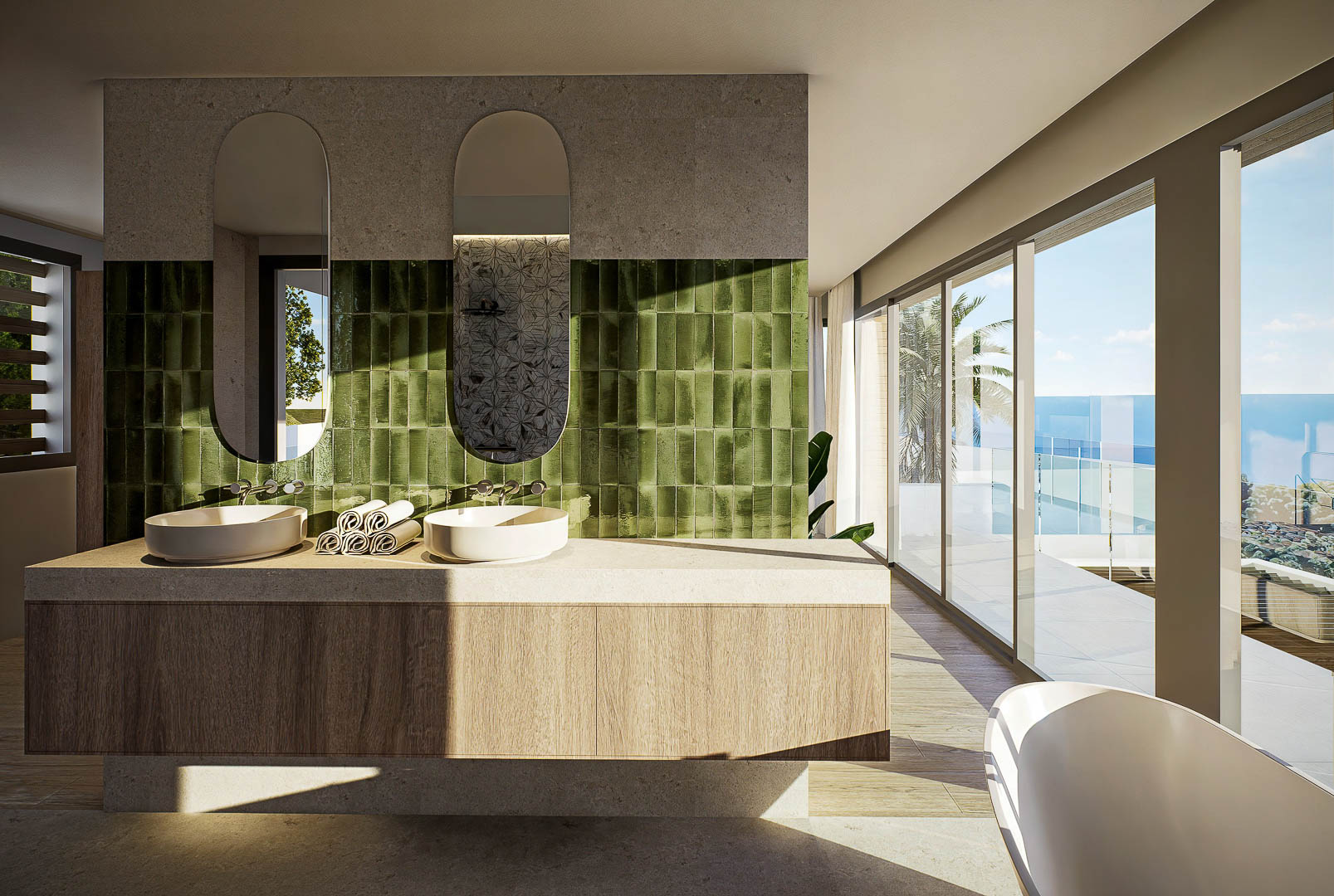 Baño principal con lavabo doble sobre mueble de madera, azulejos verdes verticales y ventanales con vistas panorámicas al mar Mediterráneo.