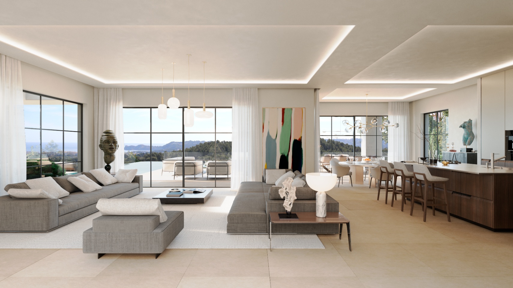 Salón comedor de concepto abierto con sofás grises, cocina integrada con isla de madera y grandes ventanales que muestran vistas panorámicas al mar y la costa.