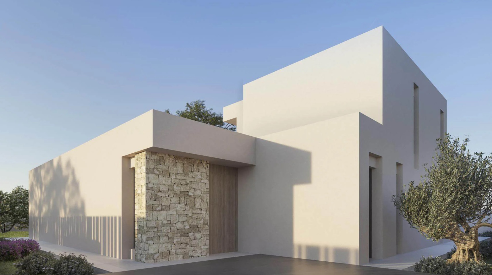 Fachada exterior de diseño minimalista con volúmenes blancos, un muro de mampostería en piedra natural y puerta principal de madera.