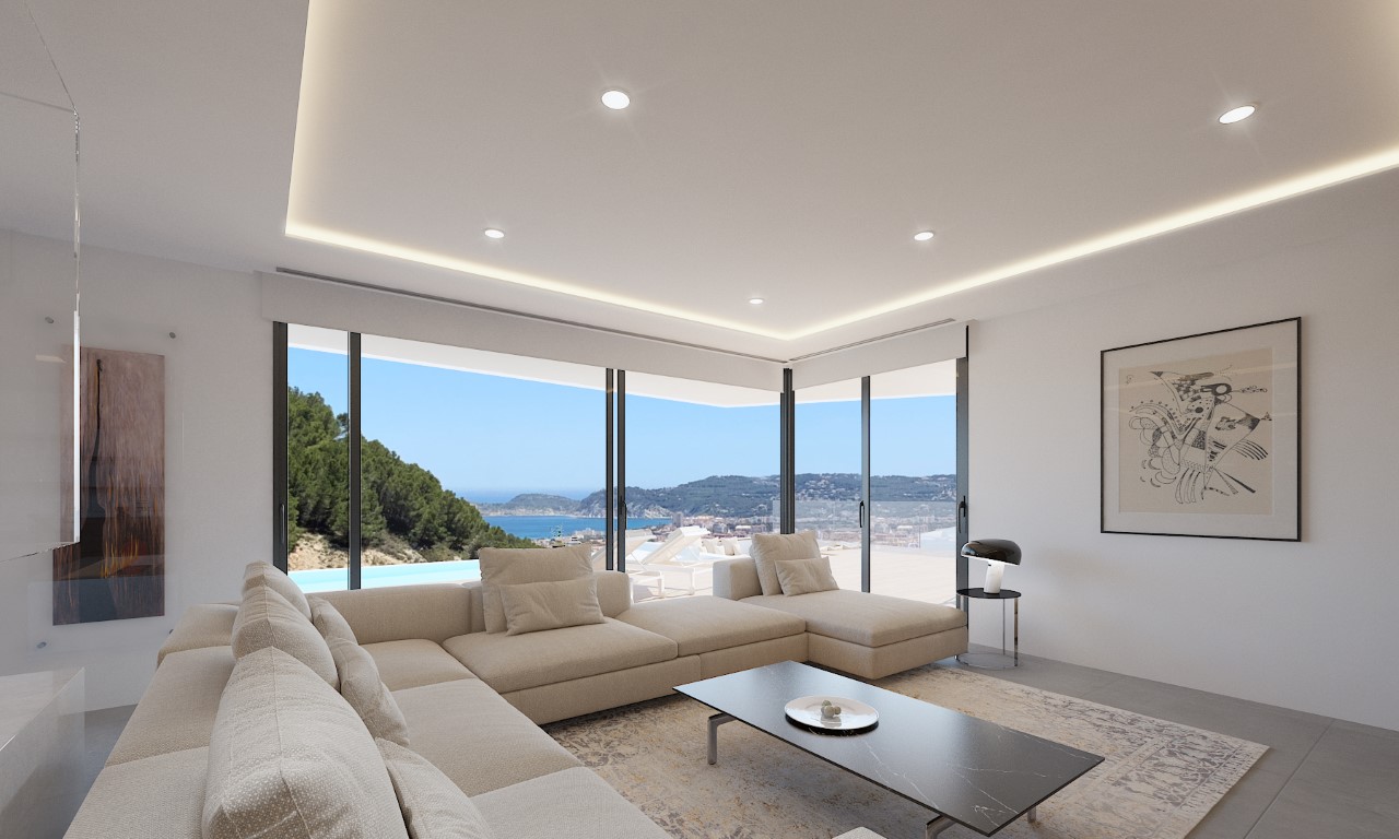 Salón luminoso con sofá modular beige y vistas panorámicas al mar.