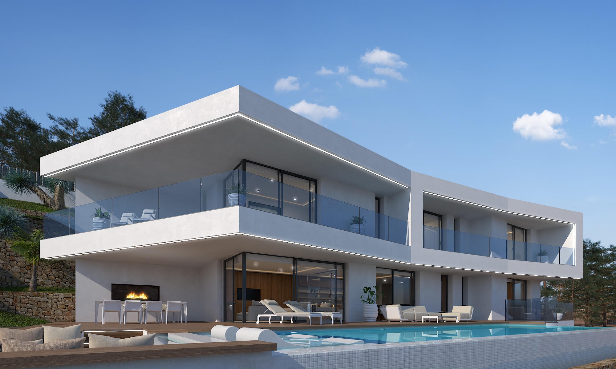 Vista exterior de la villa con piscina de mosaico blanco y terraza con chimenea.