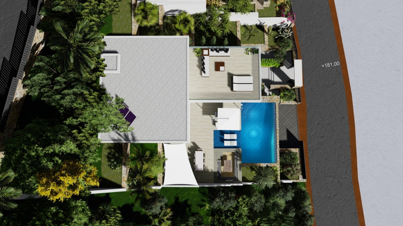 Vista aérea de la villa con piscina, terraza y jardín exuberante.