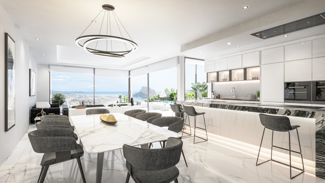Vista del comedor con mesa de mármol y cocina abierta con encimera de piedra oscura.
