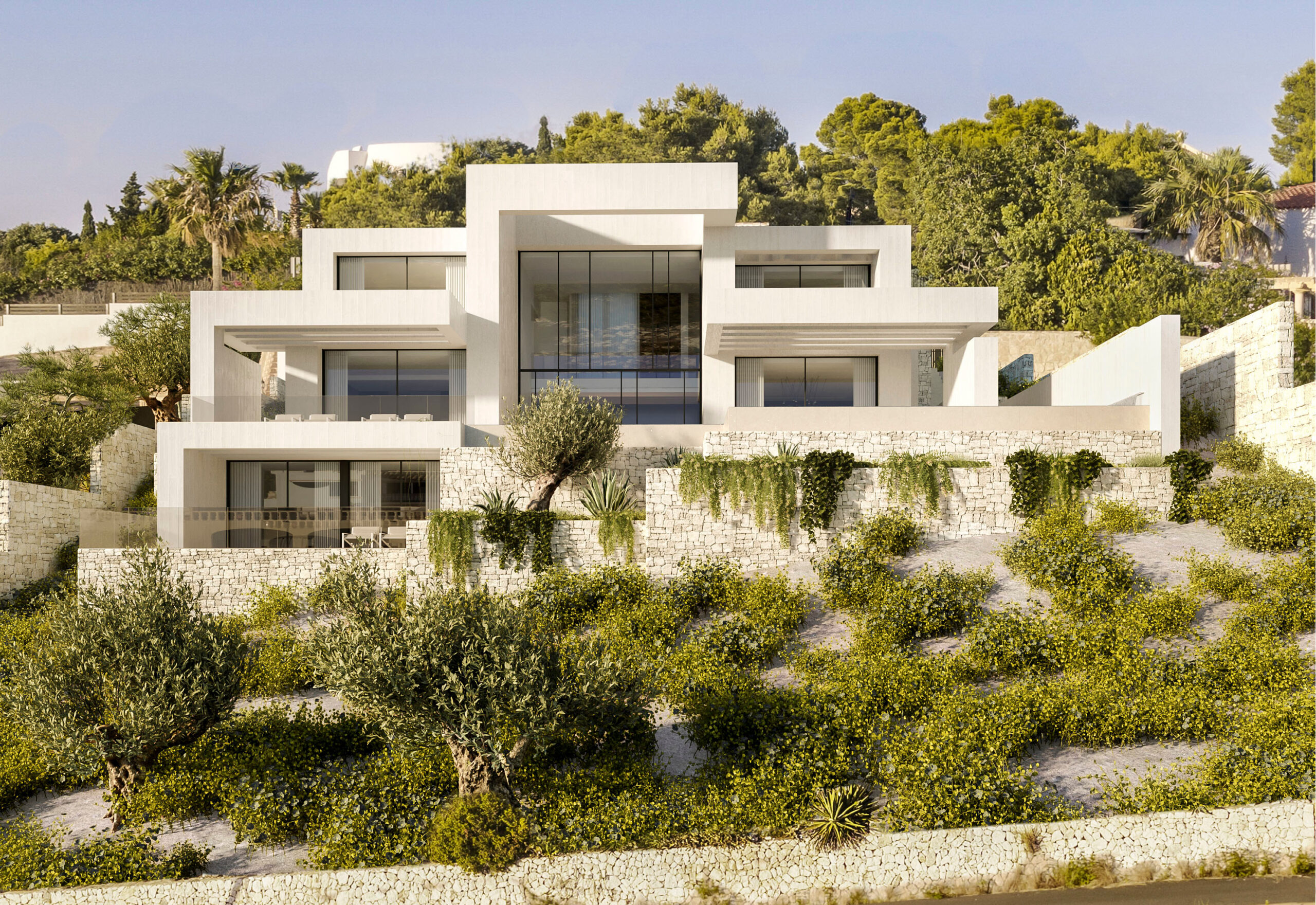 Fachada exterior de diseño contemporáneo con múltiples niveles, muros de piedra natural y amplios ventanales integrados en el paisaje mediterráneo de La Granadella.