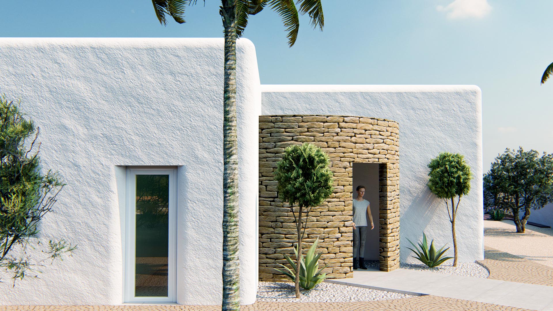Fachada de estilo ibicenco con muros de revoco blanco texturizado y una torre de entrada cilíndrica en piedra natural, rodeada de jardín mediterráneo.