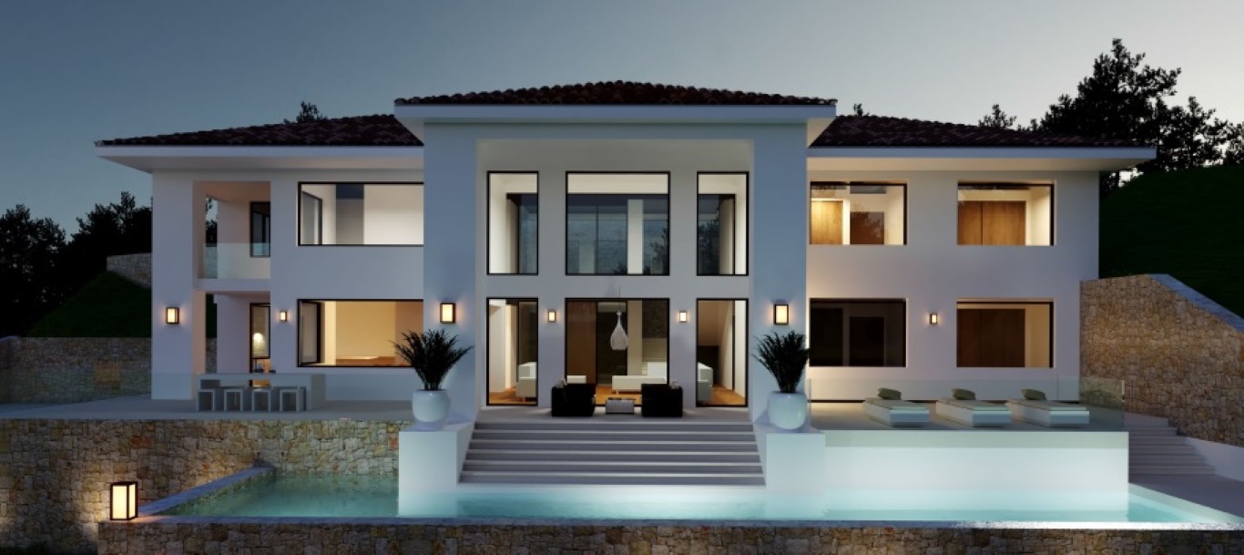 Fachada exterior de la villa al atardecer, destacando la piscina infinita, muros de piedra natural y amplios ventanales con iluminación cálida.