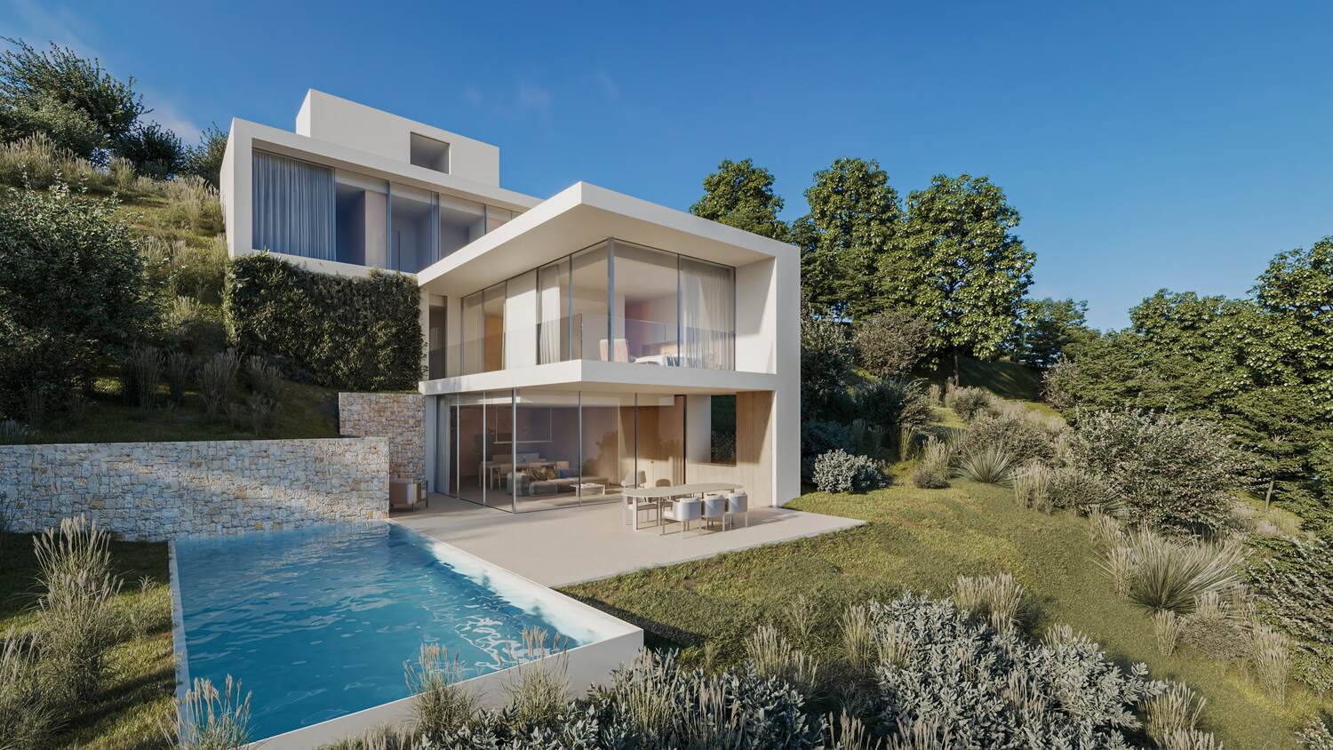 Vista exterior de la villa con arquitectura cúbica blanca, piscina rectangular y terrazas integradas en la ladera con muros de piedra natural y amplios ventanales.