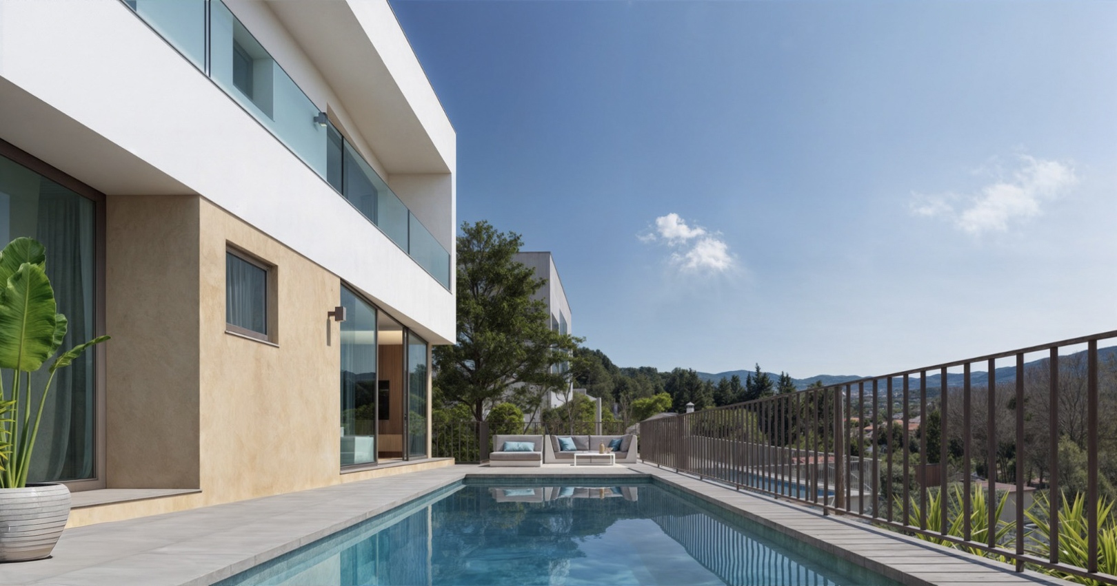 Exterior de la villa con piscina rectangular, terraza de gres porcelánico y fachada de diseño moderno con acabados en blanco y ocre frente al valle.