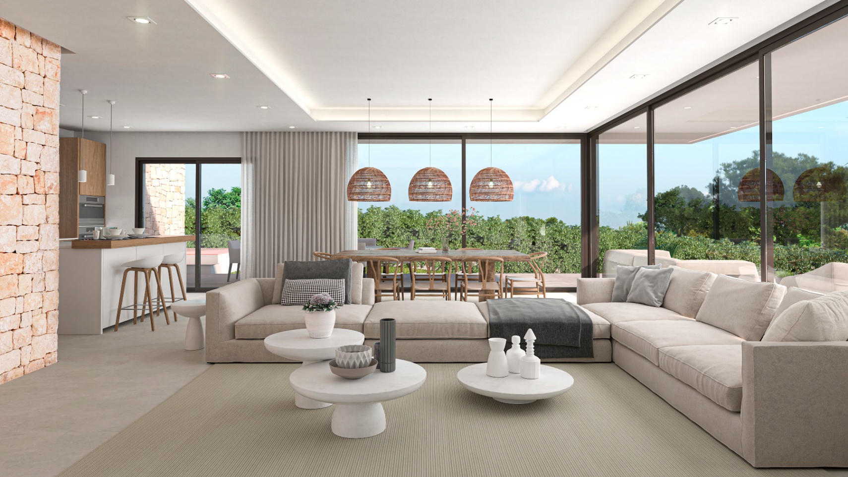 Salón luminoso con pared de piedra vista, sofás modulares beige y vistas al jardín.