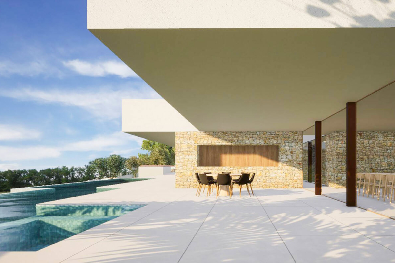 Terraza exterior con muros de piedra natural, suelos de gran formato y comedor bajo voladizo moderno, situada junto a la piscina desbordante de gresite turquesa.