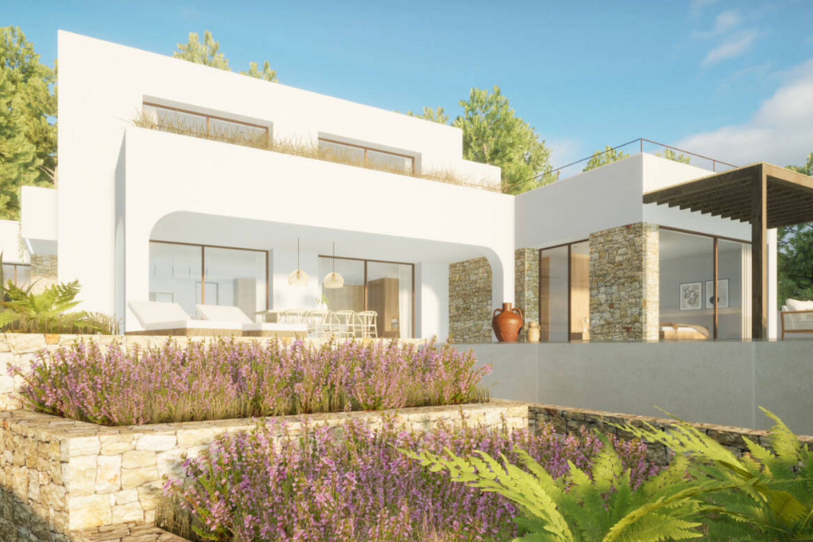 Vista exterior de la villa con jardín escalonado y fachada de piedra natural.