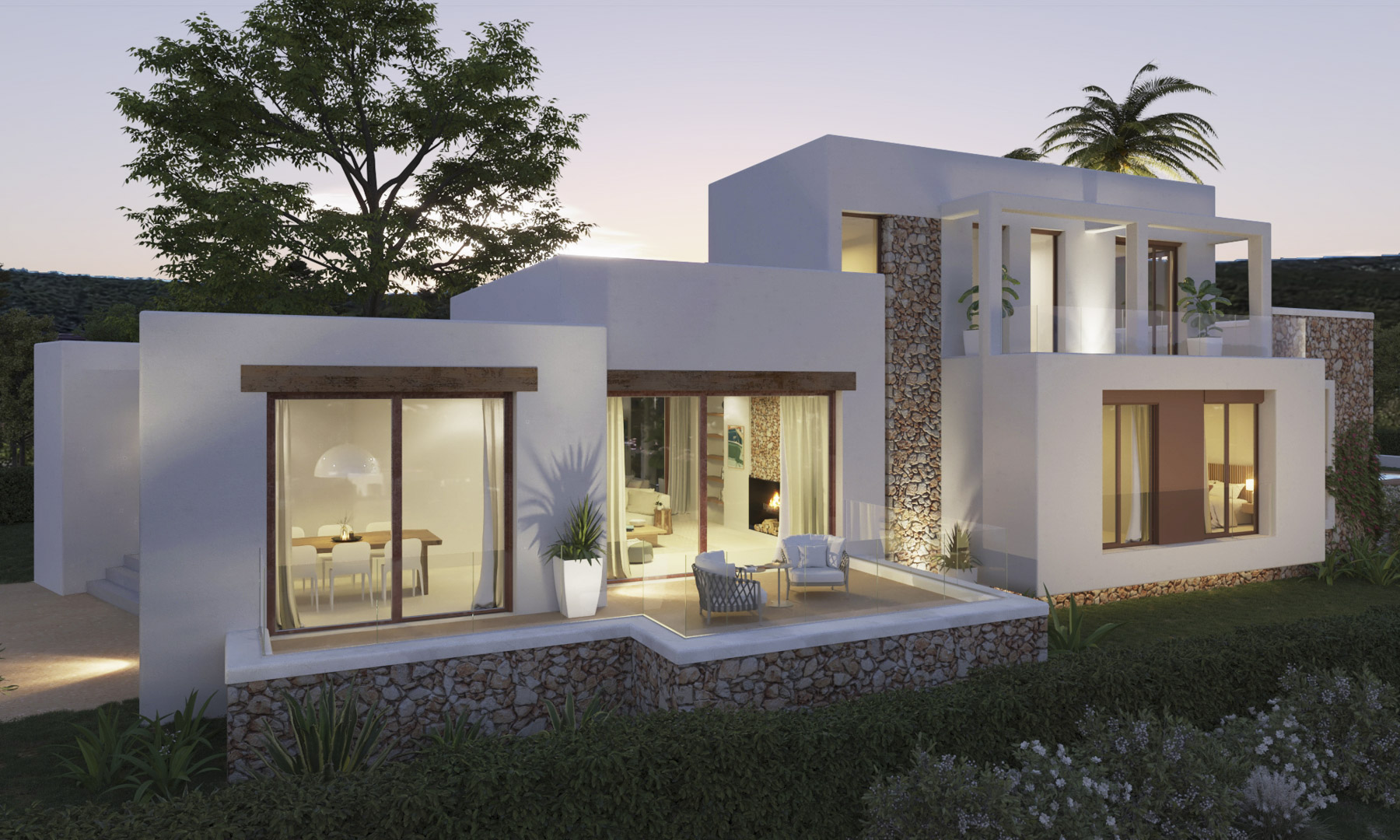 Fachada de estilo ibicenco con muros de piedra natural y paredes blancas. Destaca la terraza elevada con barandillas de cristal y amplios ventanales con marcos de madera.