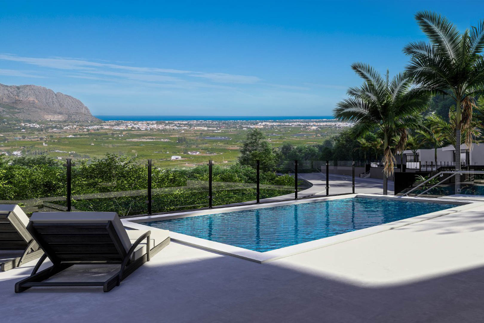 Terraza exterior con piscina de 6x3 metros, protegida por barandillas de cristal que permiten disfrutar de vistas panorámicas hacia el valle y el mar Mediterráneo.