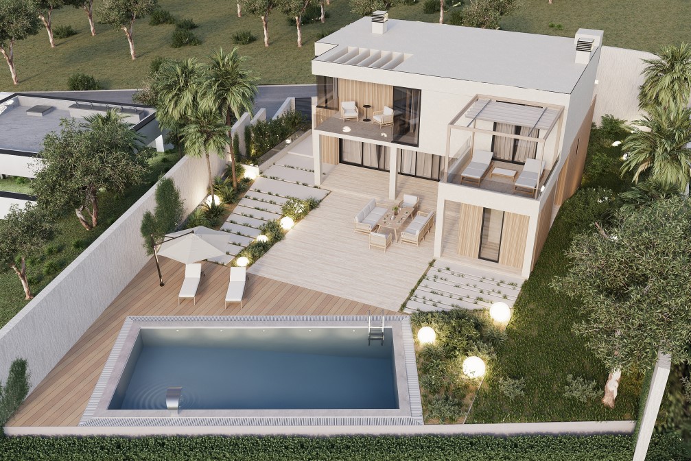 Vista aérea de la villa con piscina rectangular, terraza de madera y jardín iluminado.