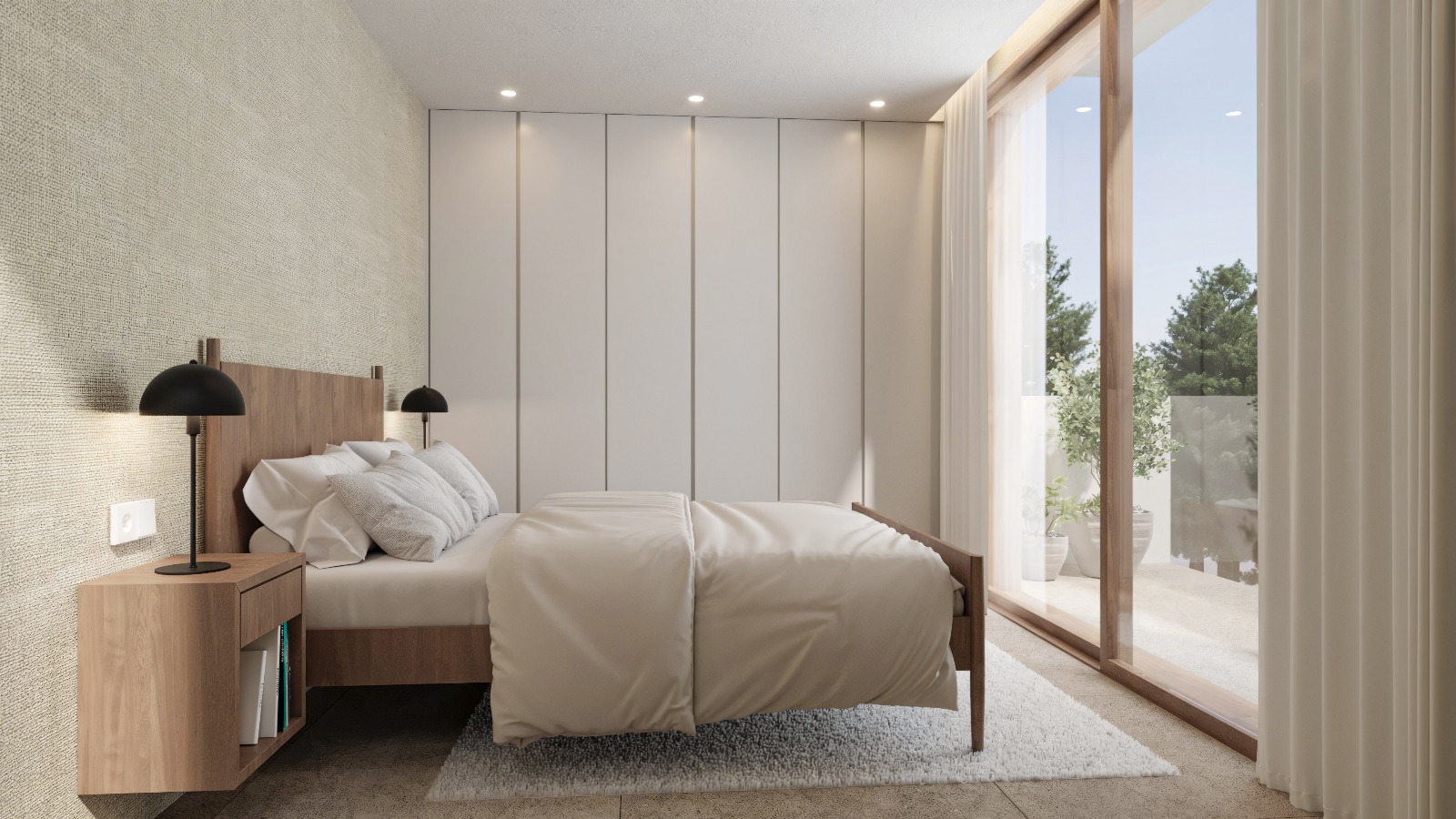 Dormitorio moderno con armarios empotrados de suelo a techo, cama de madera y grandes ventanales correderos que dan acceso directo a la terraza privada.