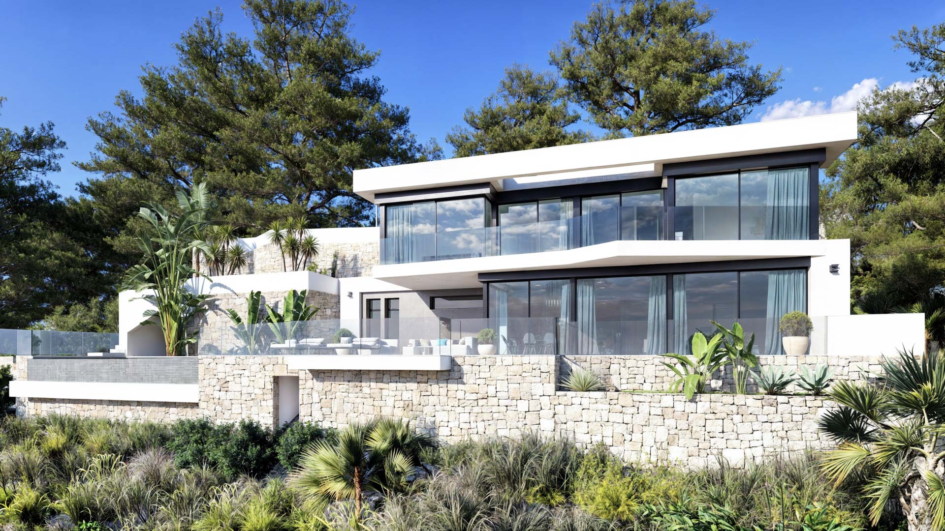 Fachada exterior de diseño contemporáneo con muros de piedra natural, amplios ventanales y terrazas con barandillas de cristal integradas en el entorno mediterráneo.