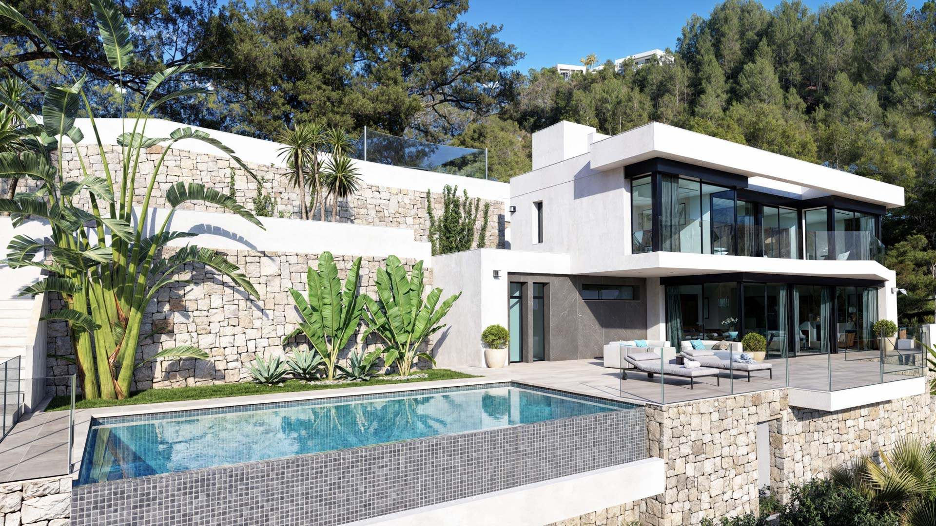 Vista exterior de la villa con piscina infinita, muros de piedra natural y terrazas con barandillas de cristal integradas en el entorno boscoso de Benissa.
