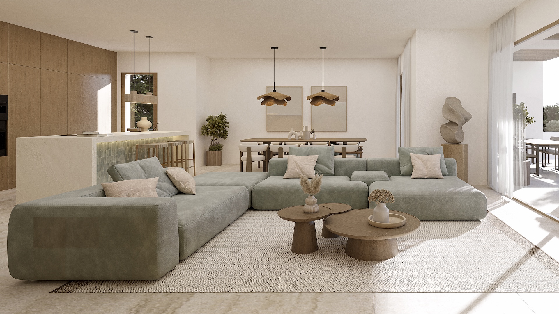 Salón diáfano con sofá modular, comedor con lámparas de diseño orgánico y cocina integrada con isla de piedra y carpintería de madera natural.