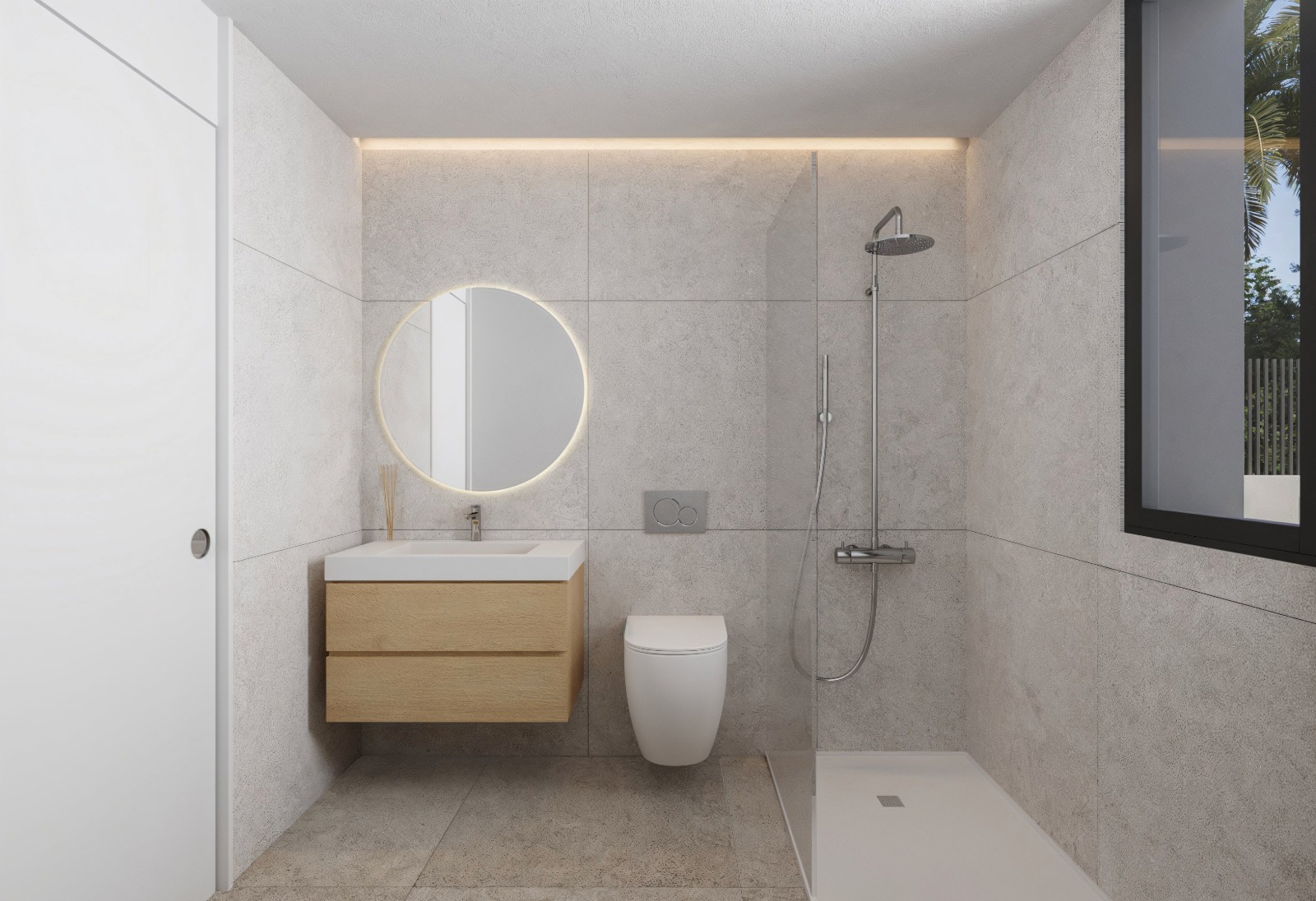 Baño moderno con azulejos de gran formato en tonos grises, lavabo suspendido de madera, espejo circular retroiluminado y ducha a ras de suelo con mampara de cristal.