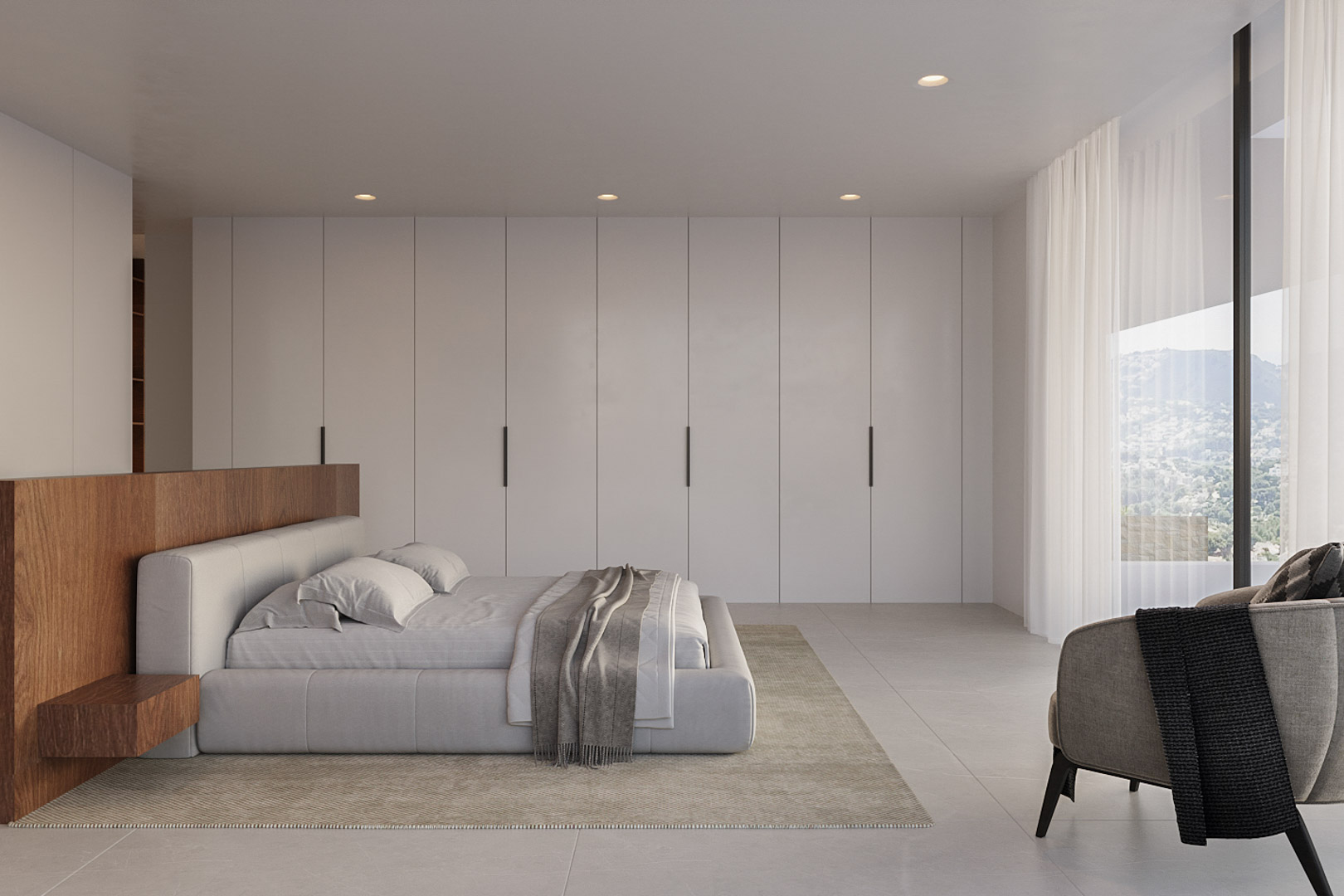 Dormitorio contemporáneo con armarios empotrados minimalistas, cabecero de madera noble y ventanal con vistas despejadas a la montaña y luz natural.