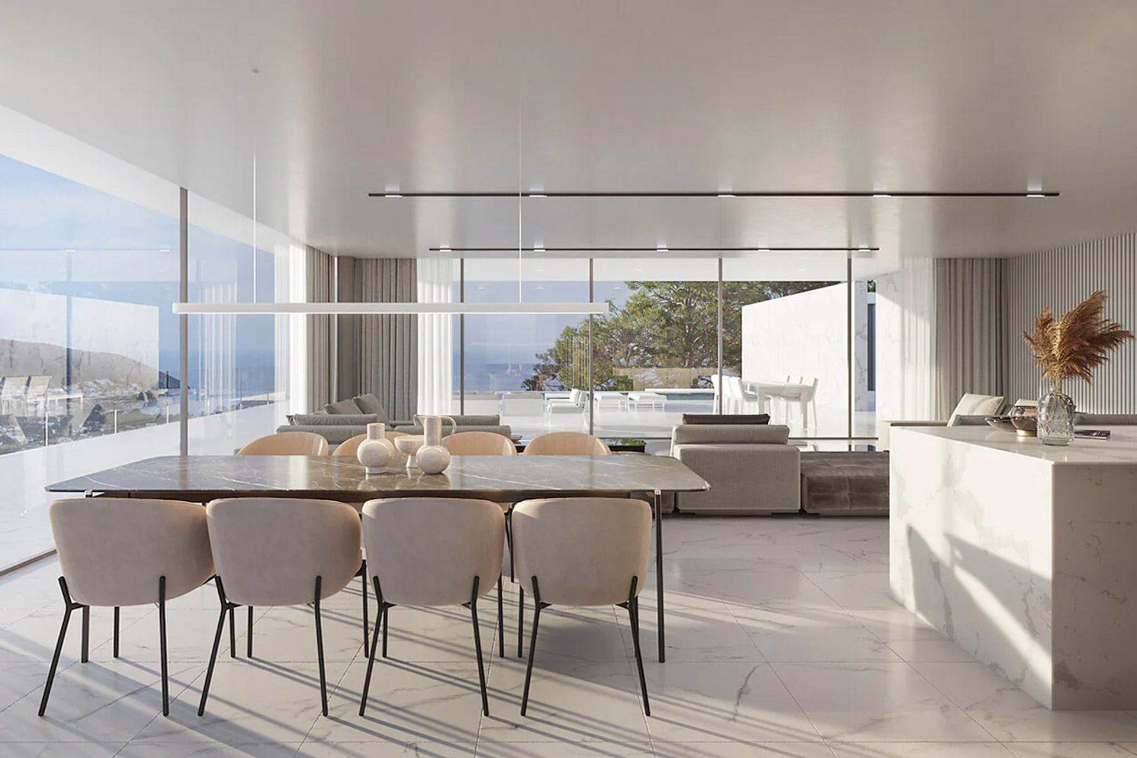 Amplio salón-comedor de concepto abierto con suelos de mármol blanco, mesa de diseño y ventanales de suelo a techo con vistas panorámicas al mar.