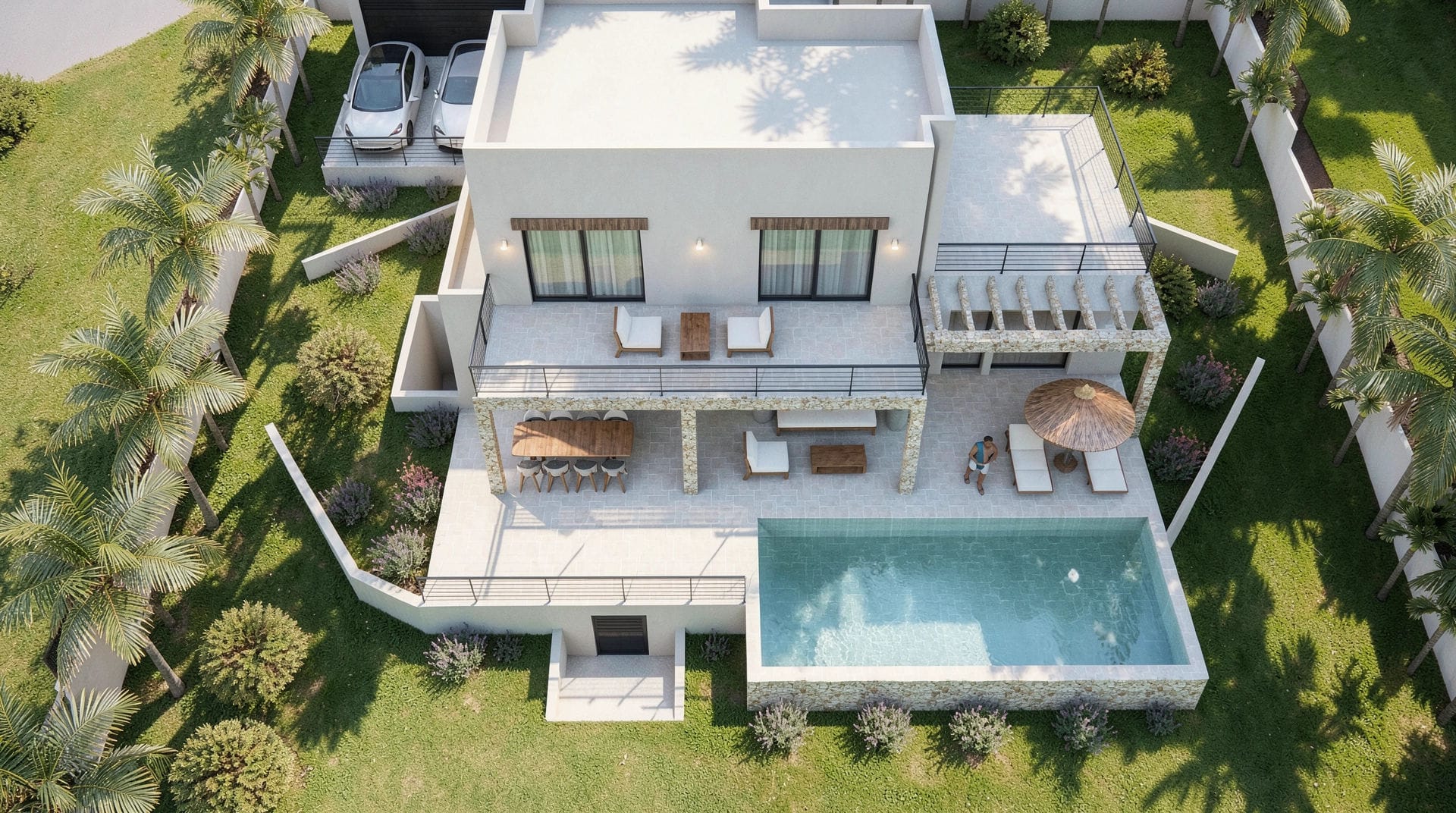 Vista aérea de la villa moderna con piscina rectangular, terrazas en dos niveles con acabados en piedra natural y jardín mediterráneo con palmeras.