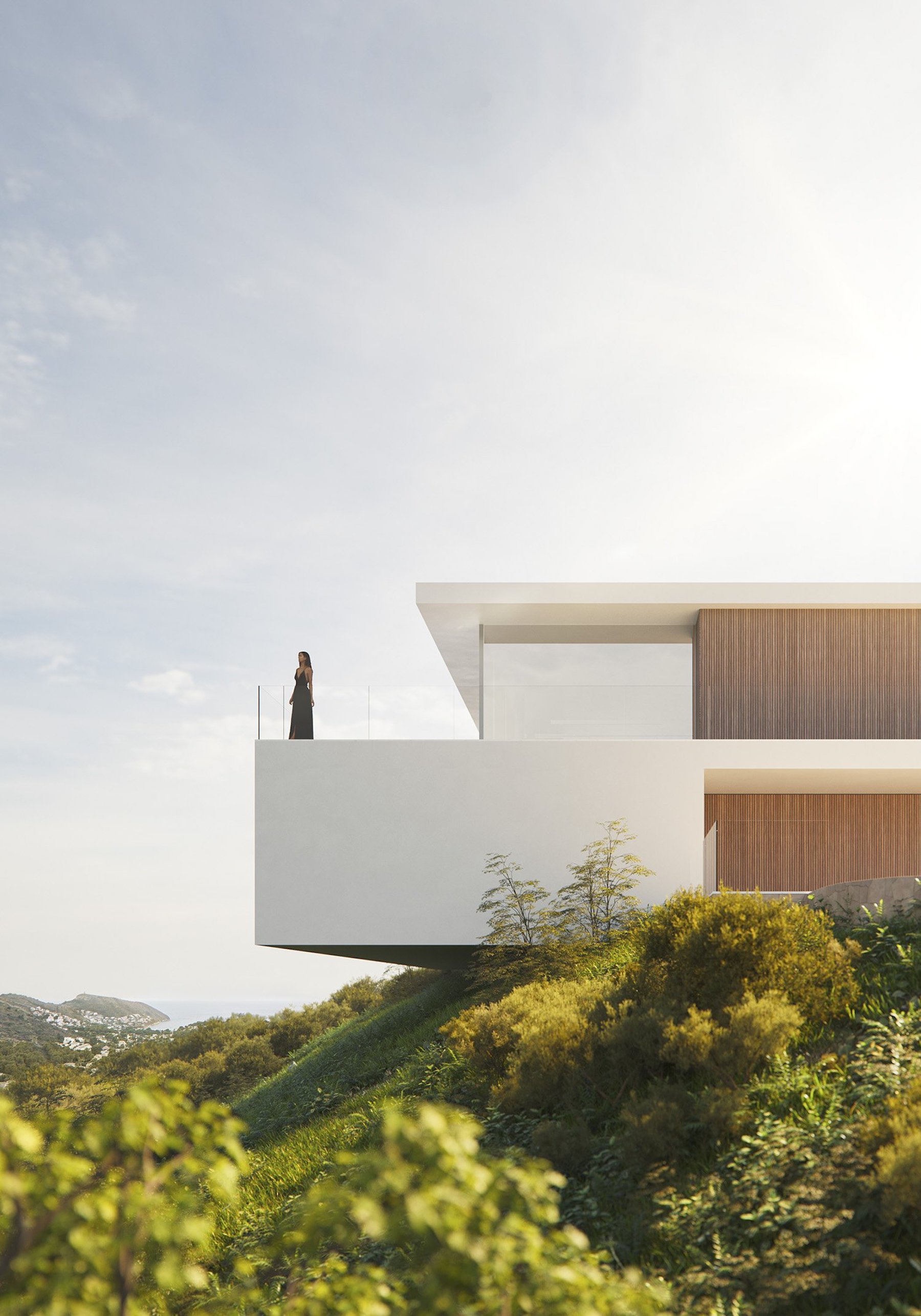 Terraza volada de diseño minimalista con barandilla de vidrio, acabados en madera y vistas panorámicas sobre el paisaje mediterráneo y la costa.