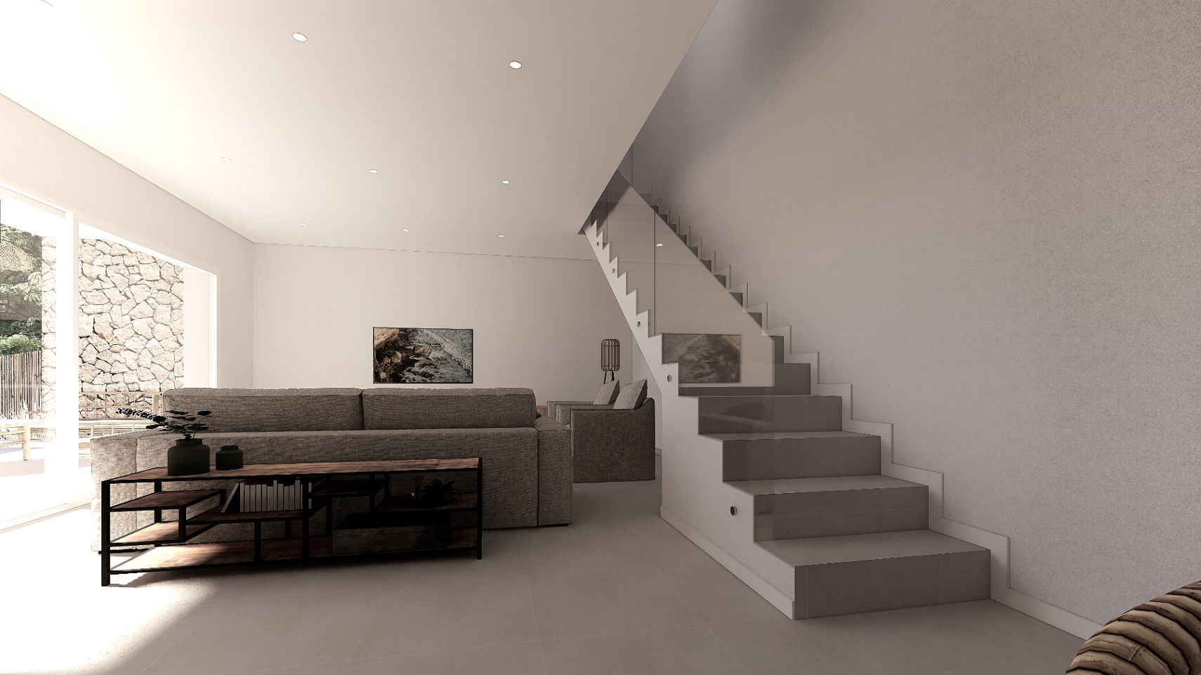 Salón moderno con sofá gris, estantería industrial y escalera minimalista con barandilla de cristal e iluminación integrada. Grandes ventanales conectan con el exterior de piedra.