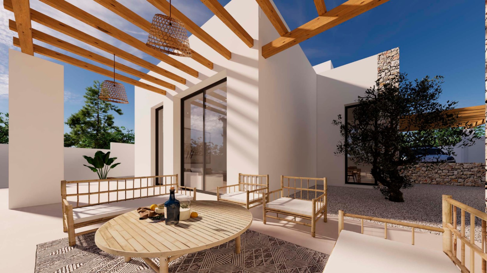 Terraza de estilo ibicenco con pérgola de vigas de madera, mobiliario de bambú y lámparas de mimbre. El espacio exterior incluye un olivo y muros de piedra natural.