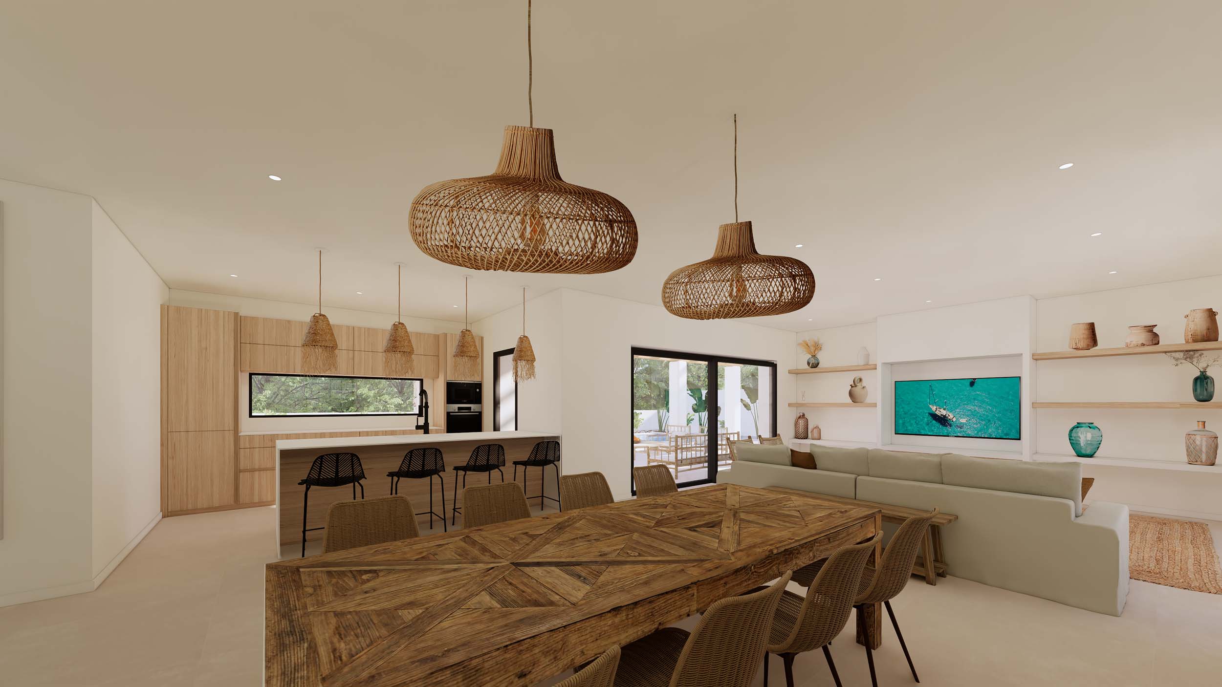 Salón-comedor diáfano con mesa de madera rústica, lámparas de mimbre y cocina integrada con isla. Grandes ventanales conectan el espacio con la terraza exterior.