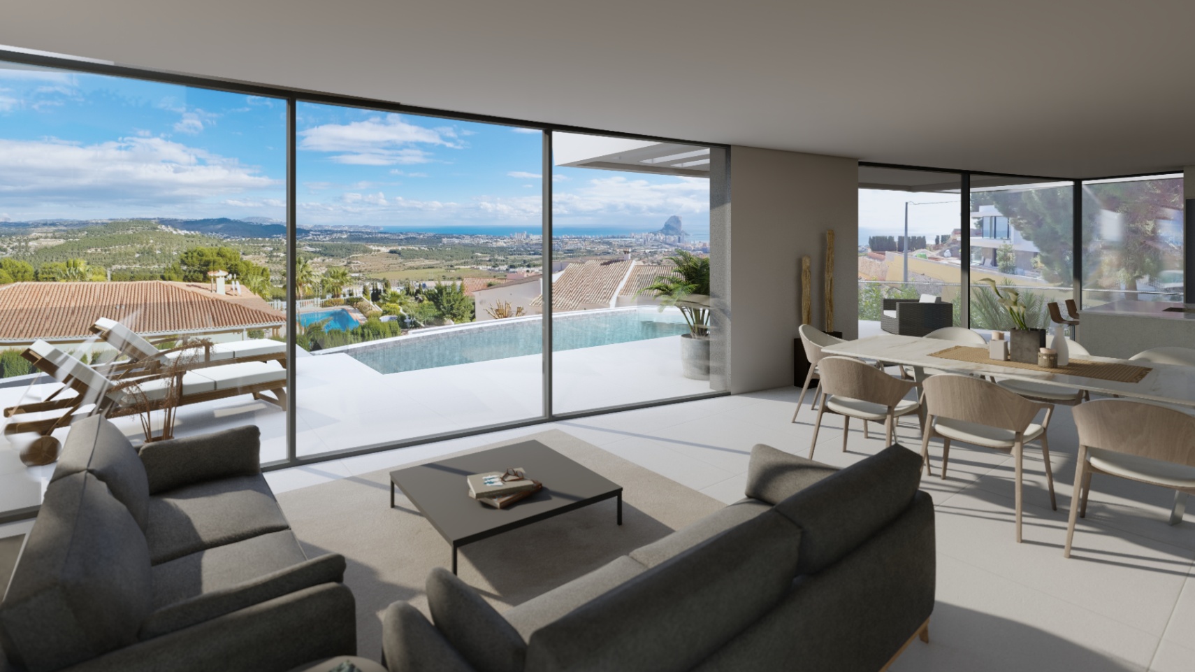 Salón comedor de concepto abierto con amplios ventanales que ofrecen vistas panorámicas al mar y al Peñón de Ifach, conectando con la terraza y la piscina infinita.