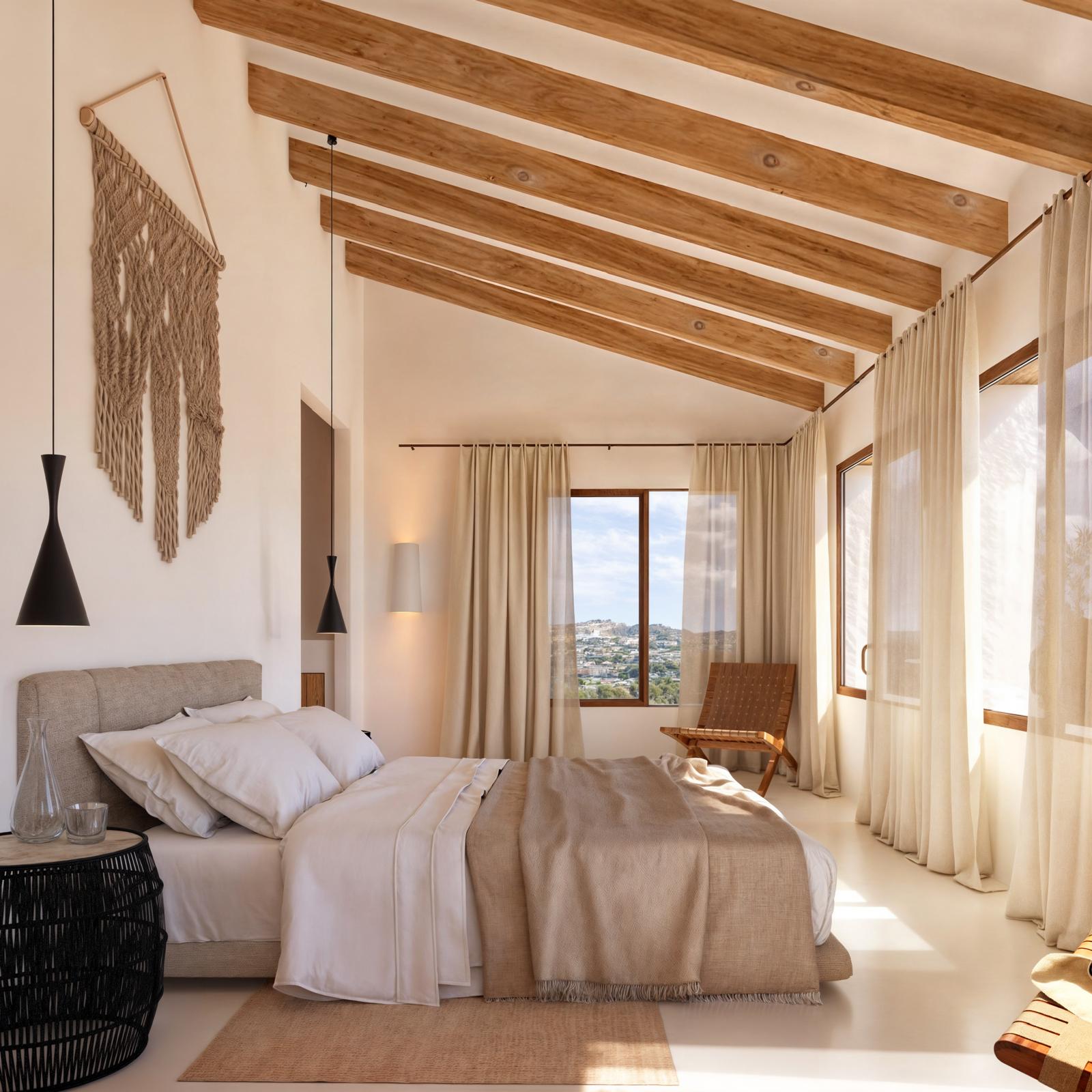 Dormitorio principal con techos altos de vigas de madera inclinadas, grandes ventanales con vistas panorámicas y una decoración en tonos neutros y materiales naturales.