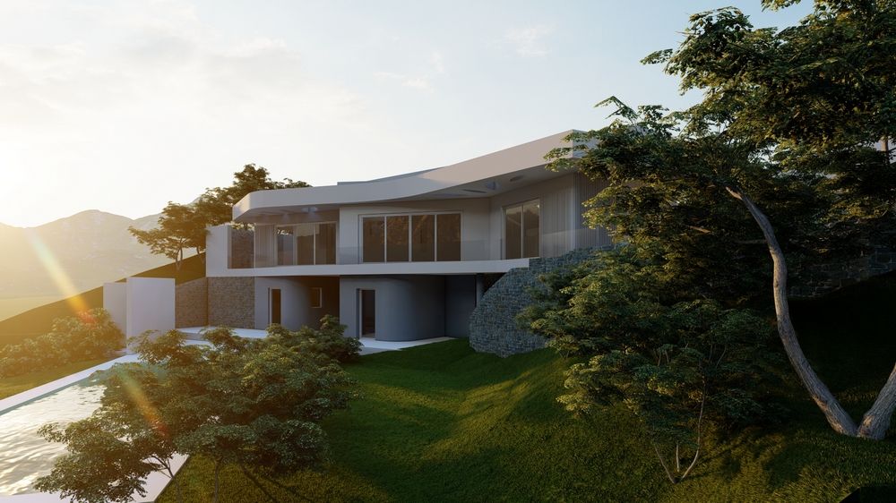 Vista exterior de la villa contemporánea con cubiertas curvas, muros de piedra natural y amplios ventanales integrados en una parcela aterrazada con vegetación.