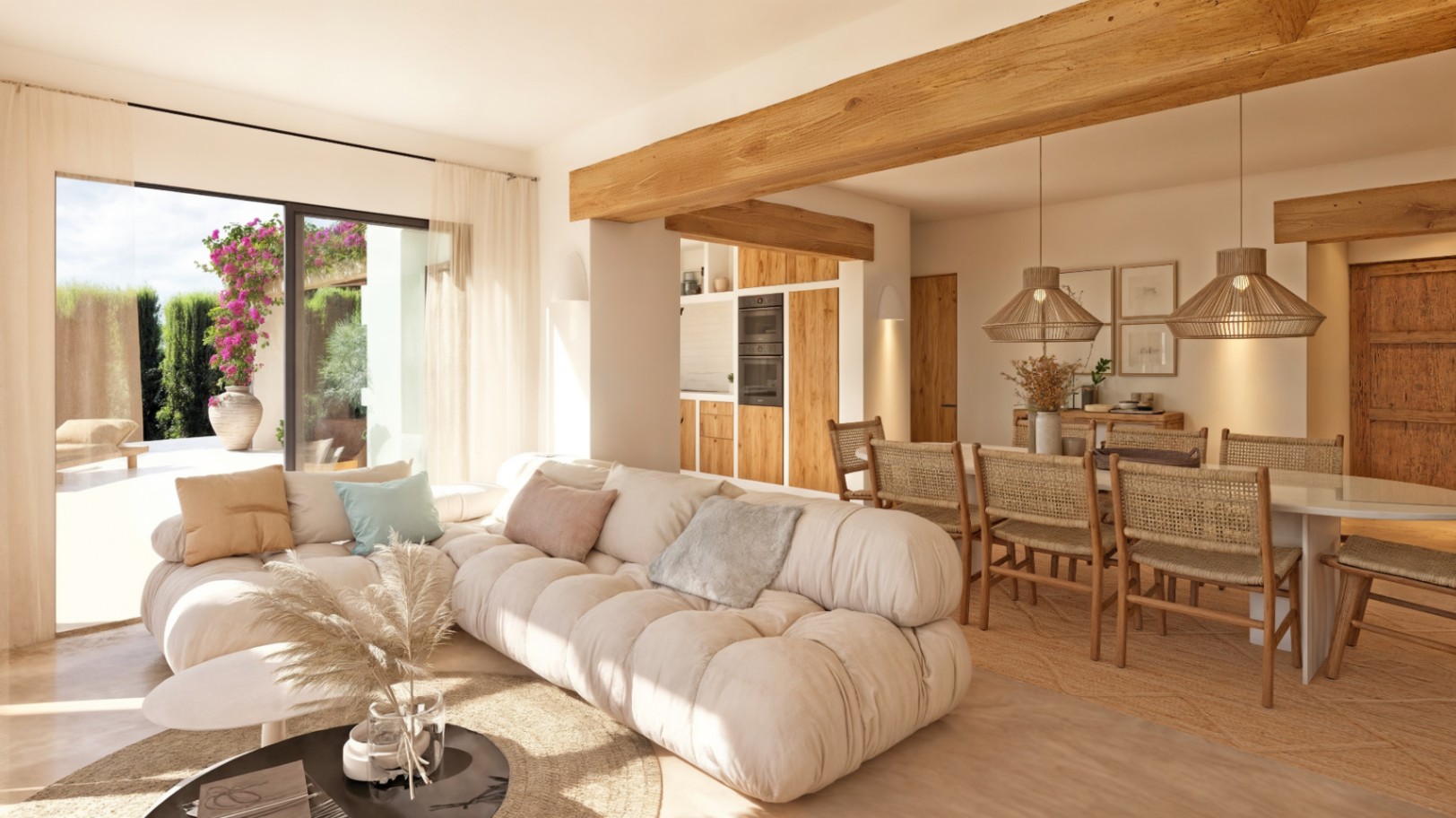 Salón-comedor diáfano con vigas de madera vista, mobiliario de estilo ibicenco y grandes ventanales que conectan con la terraza exterior y el jardín.