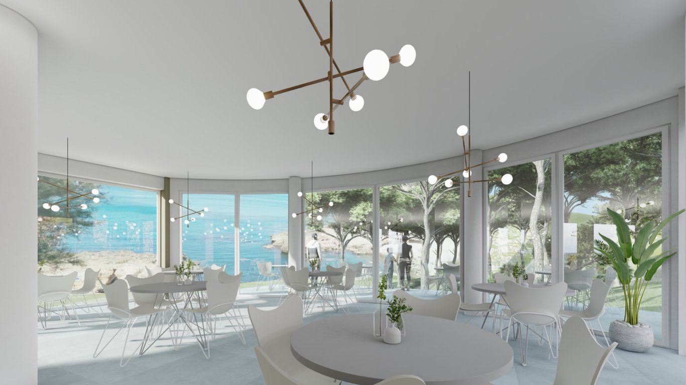 Comedor diáfano con grandes ventanales curvos de suelo a techo, vistas directas al Mediterráneo, mobiliario minimalista blanco y lámparas de diseño contemporáneo.