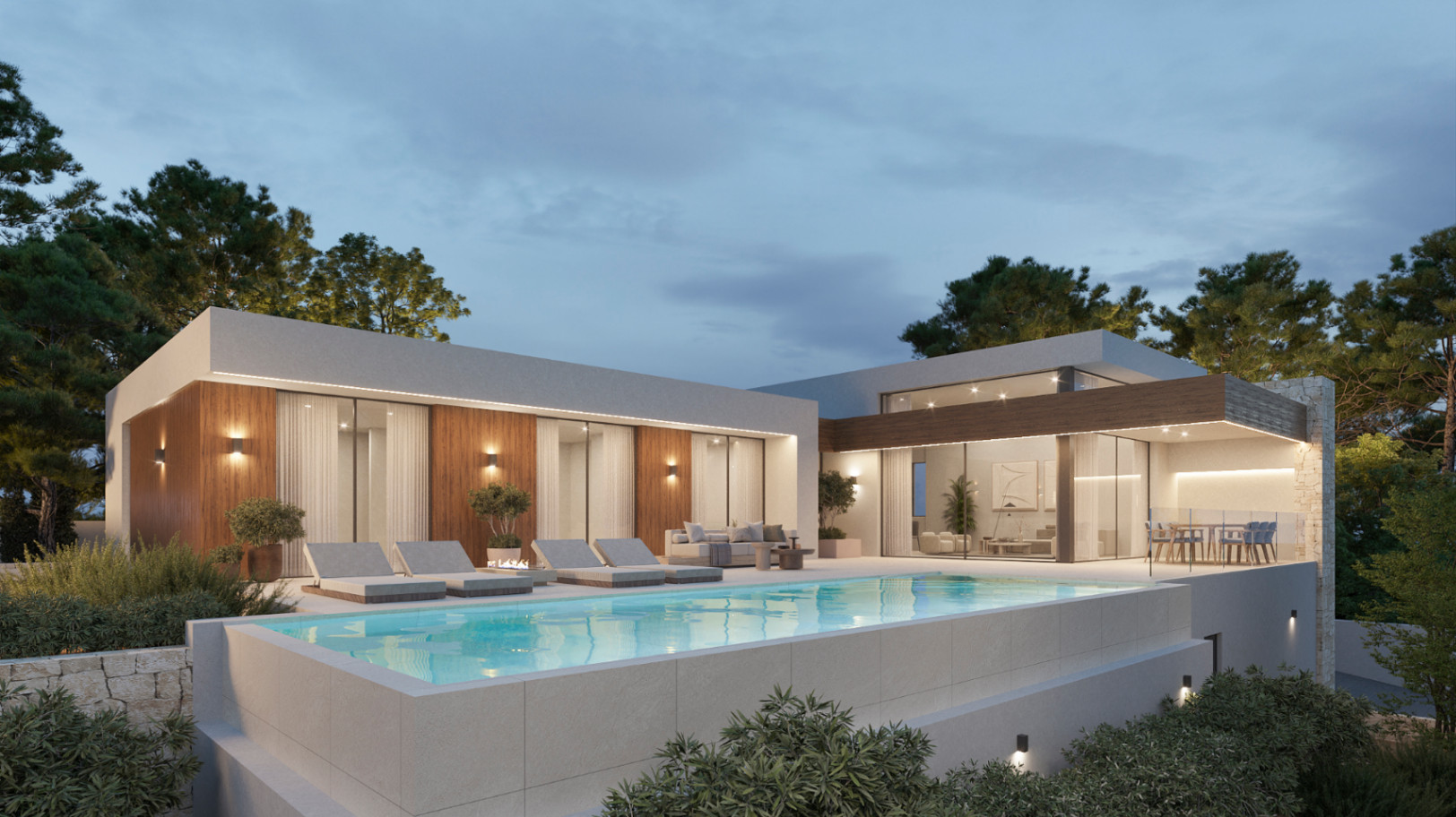 Vista exterior nocturna de la villa con piscina elevada, fachada con paneles de madera y amplios ventanales que conectan el salón con la terraza.