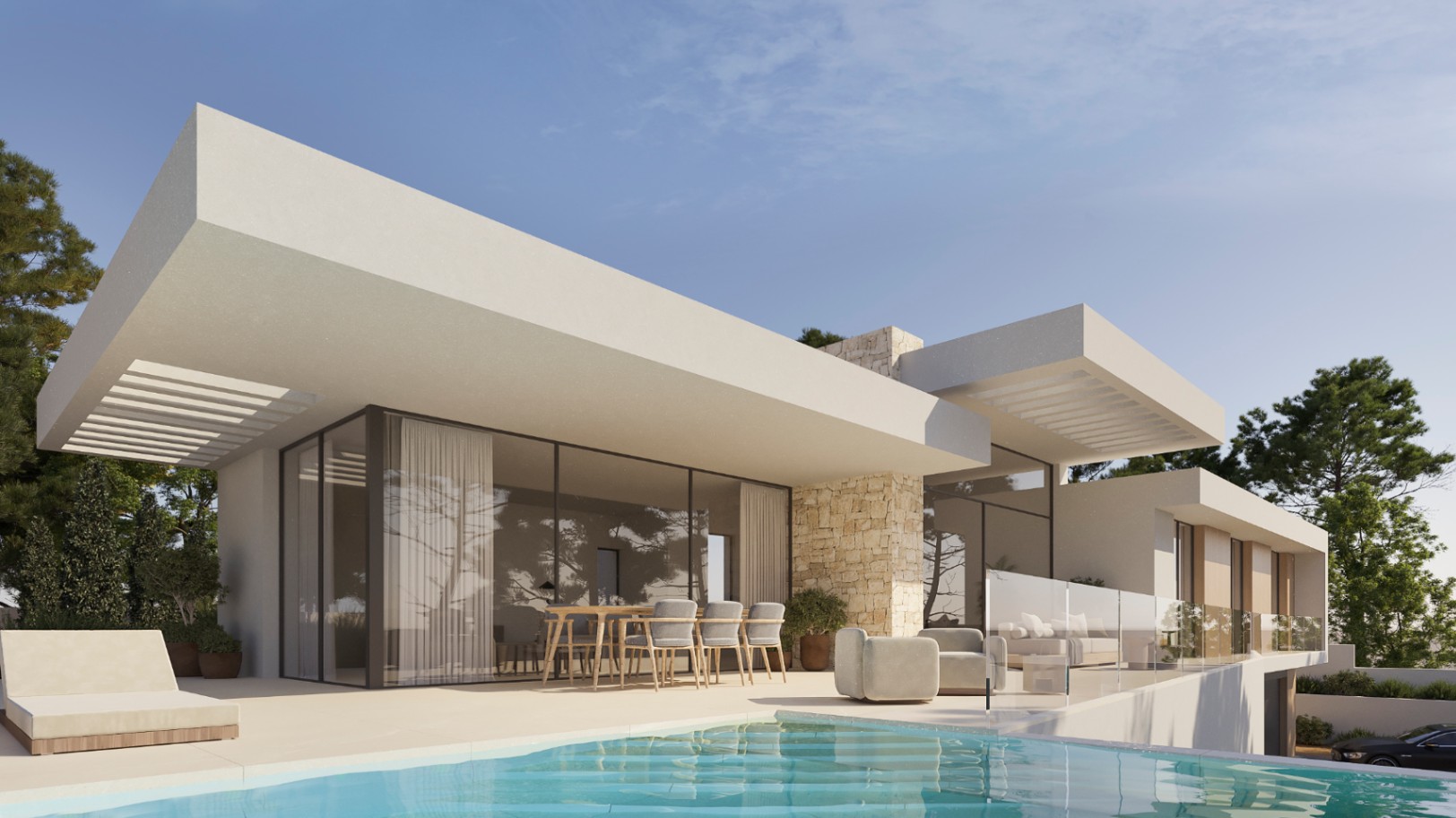Vista exterior de la villa moderna con piscina, terraza de gres porcelánico, zona de comedor al aire libre y fachada con detalles de piedra natural y grandes ventanales.