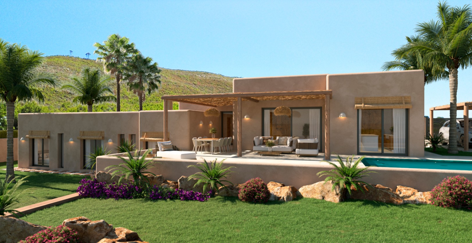 Vista exterior de la villa con fachada en tonos tierra, amplia terraza con pérgola de madera, zona de estar y piscina integrada en un jardín mediterráneo con palmeras.