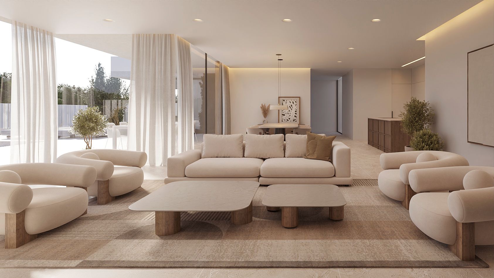 Salón de concepto abierto con mobiliario de tonos neutros, suelos de piedra y amplios ventanales que integran el interior con la terraza exterior mediante cortinas vaporosas.