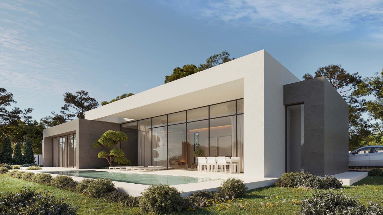 Fachada contemporánea de una planta con grandes ventanales, piscina integrada y terraza con comedor exterior rodeada de jardines mediterráneos.